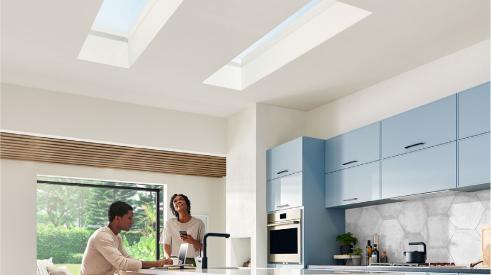 Couple sitting under a skylight in the kitchen