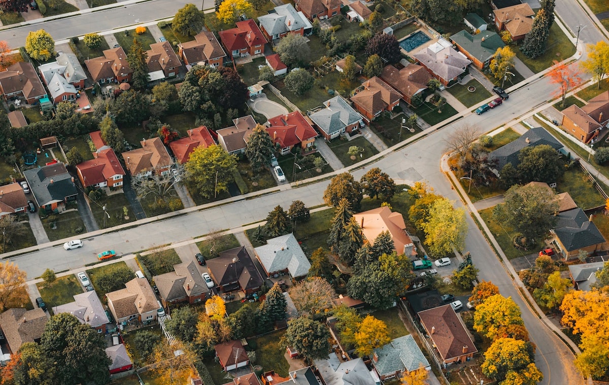 Aerial view of houses in residential community in autumn