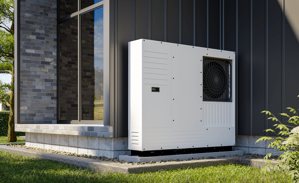 Heat pump installed next to outside wall new single-family home