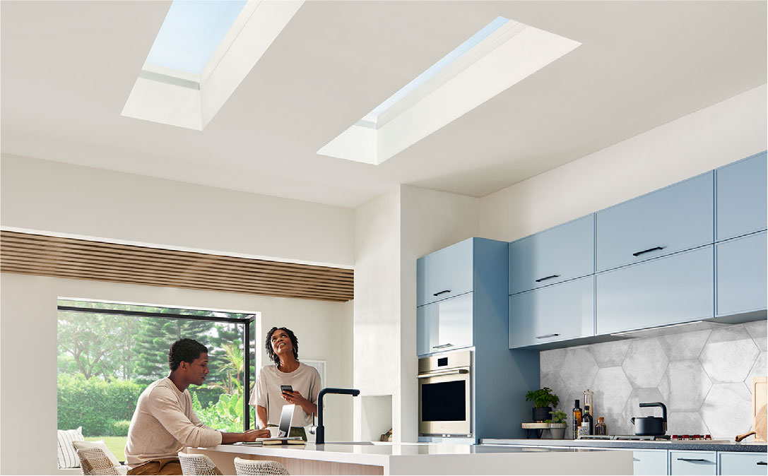 Couple sitting under a skylight in the kitchen