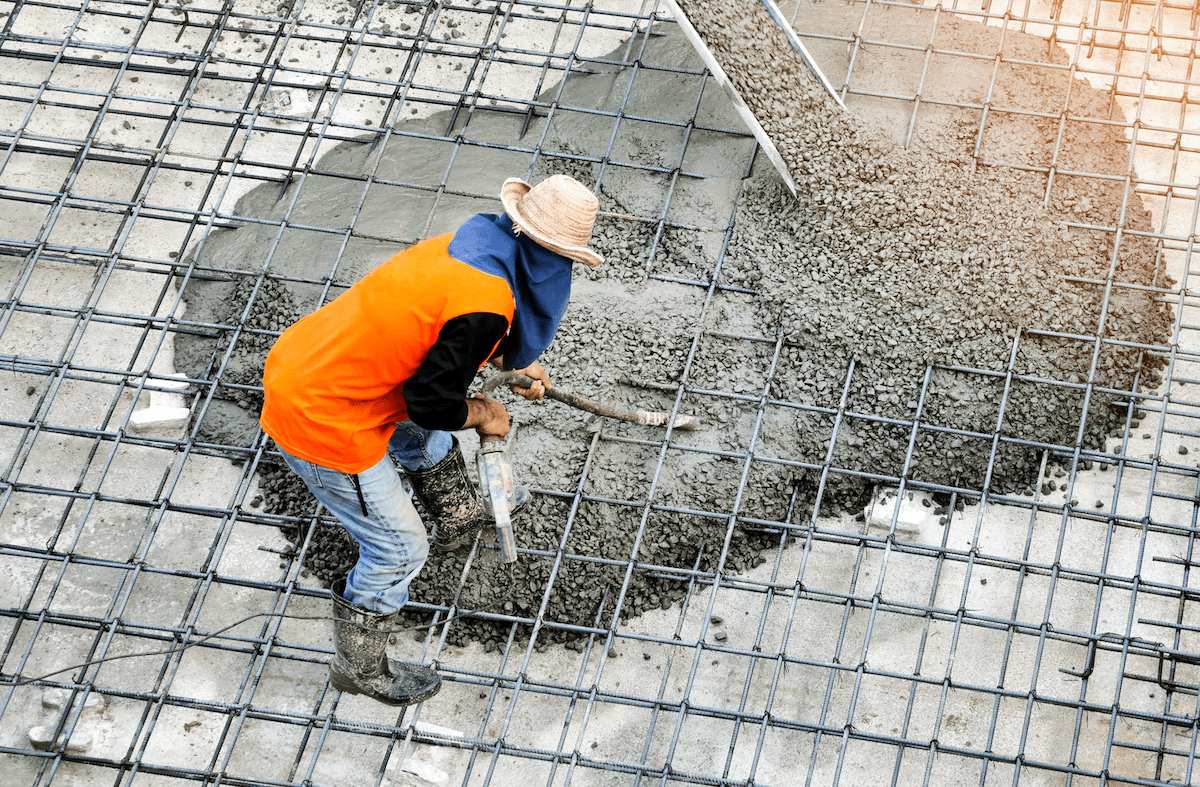 Pouring concrete slab on construction jobsite