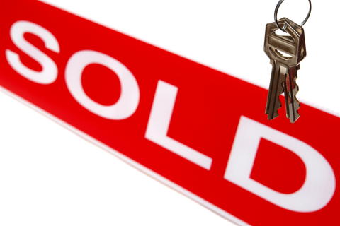 Sold sign with house keys