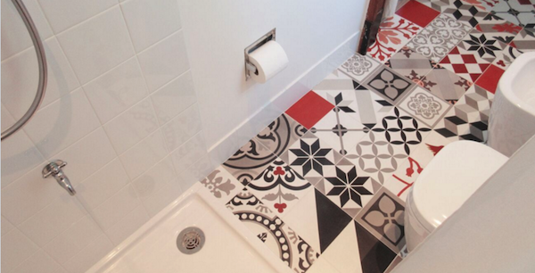 Colorful, whimsical floor tile makes this white bathroom by Studio Habeas Corpus pop. The project won a honorable mention in the Duravit Designer Dream Bath Competition. 