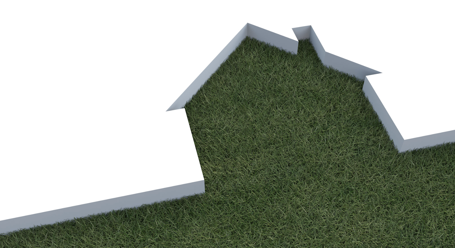 Green home cutout with grass