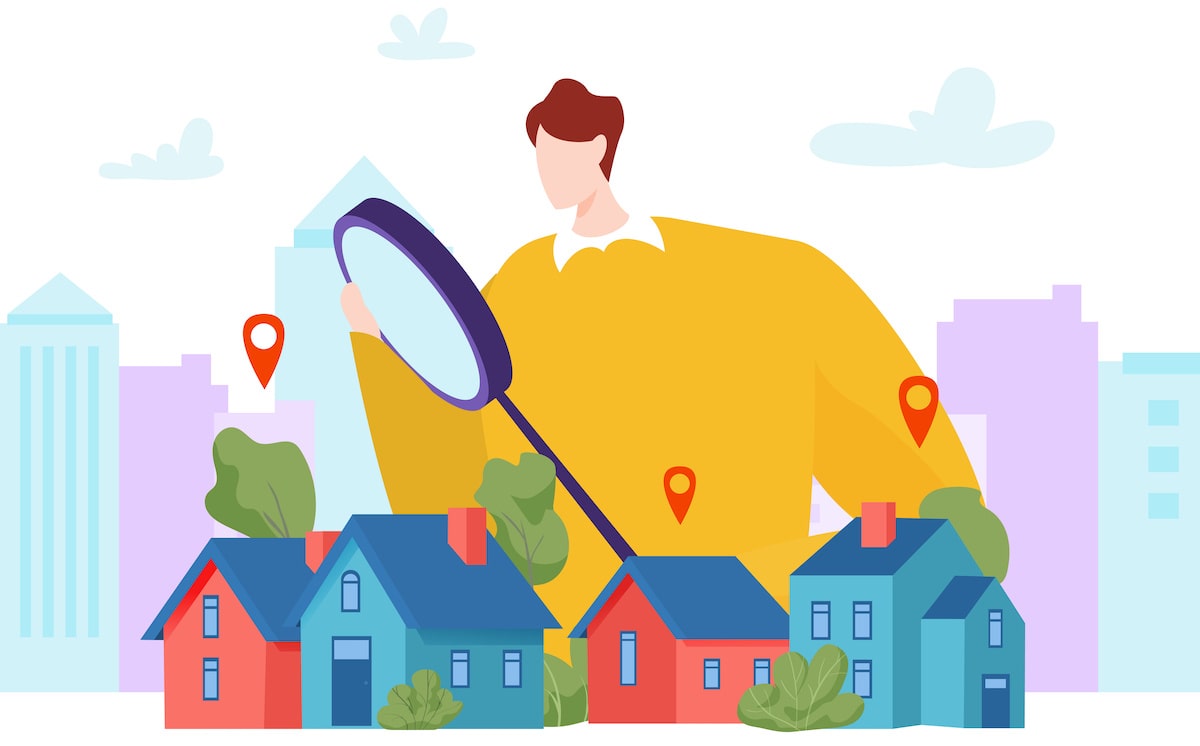 Graphic of person holding magnifying glass over a group of houses