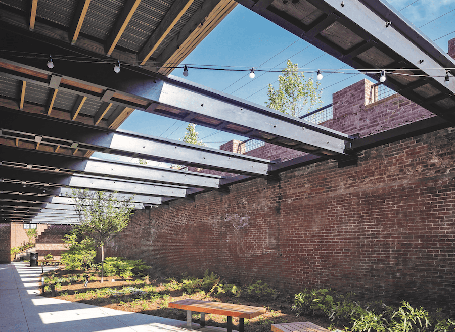 Outdoor living space at the Chronicle Mill adaptive reuse project, a 2023 BALA winner for adaptive reuse 