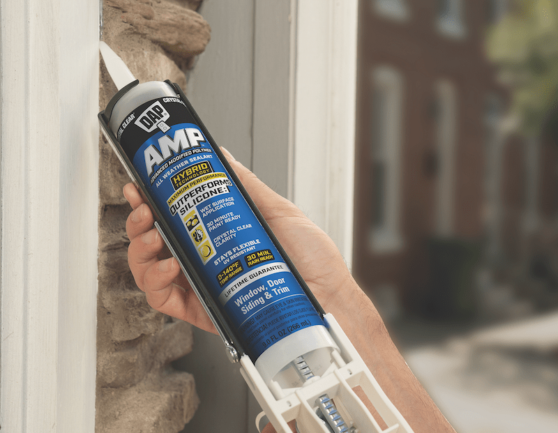 DAP AMP All Weather Window, Siding, and Door Sealant being applied to window-wall junction
