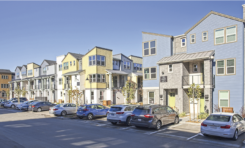 street view of exterior infill housing development Nova at the Vale, yellow-blue-gray color scheme
