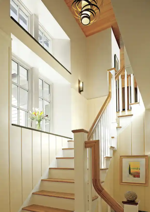 Windows on stairway add light and interest to the space