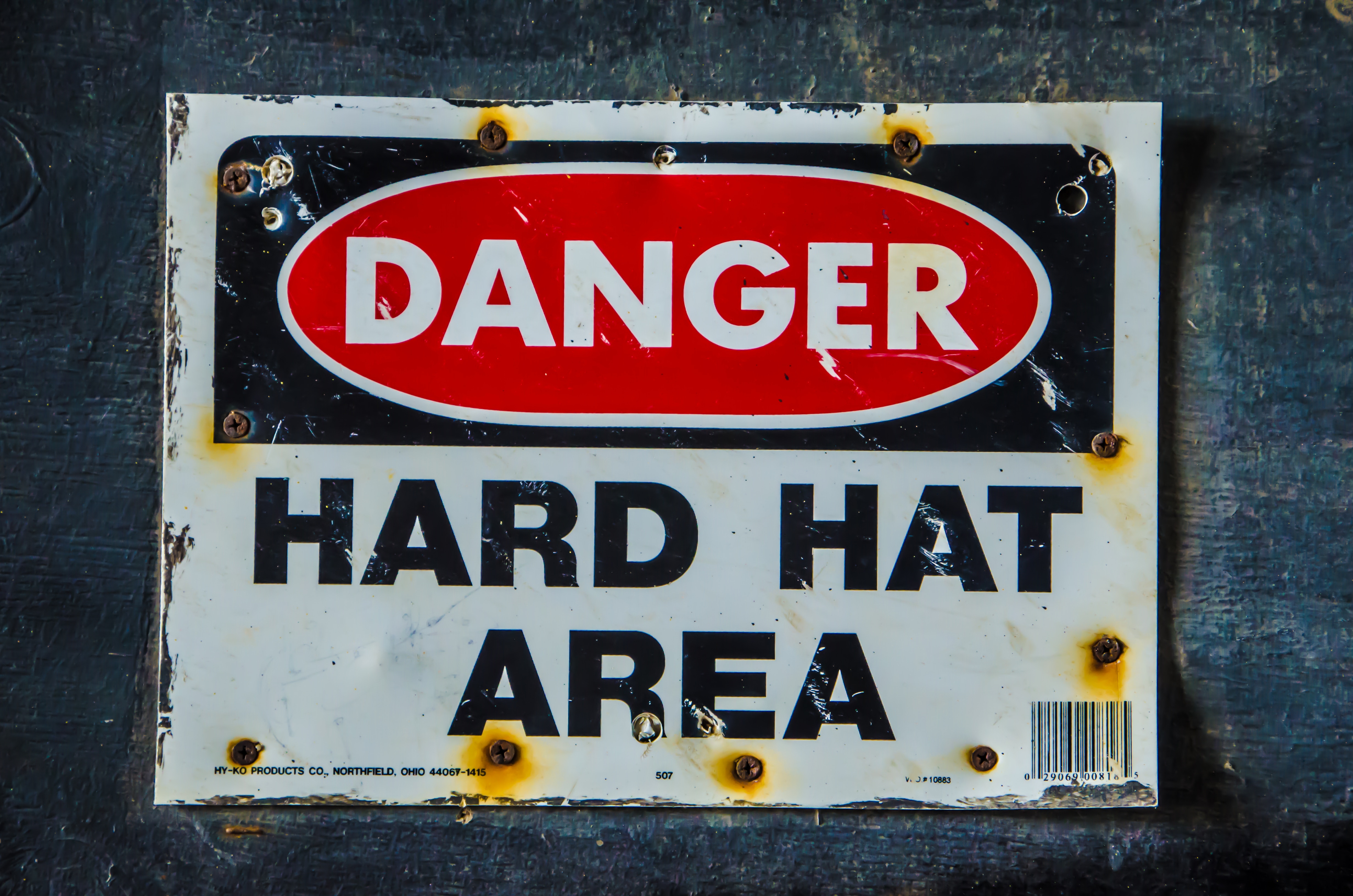 Sign saying "Danger Hard Hat Area"