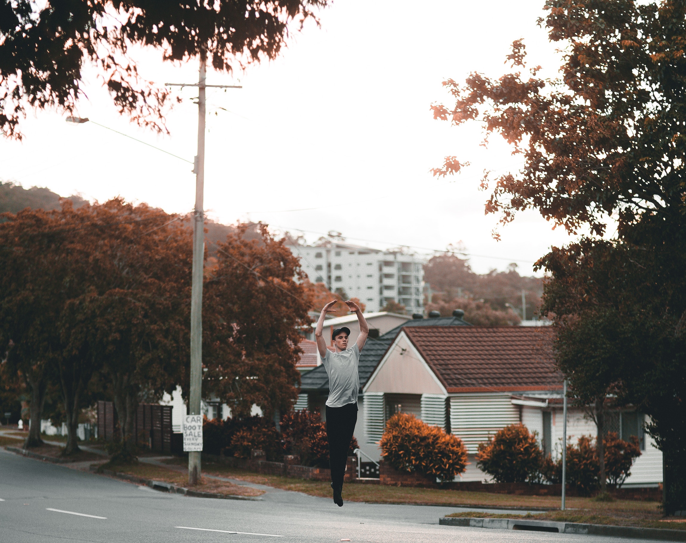 Man dancing on a suburban street