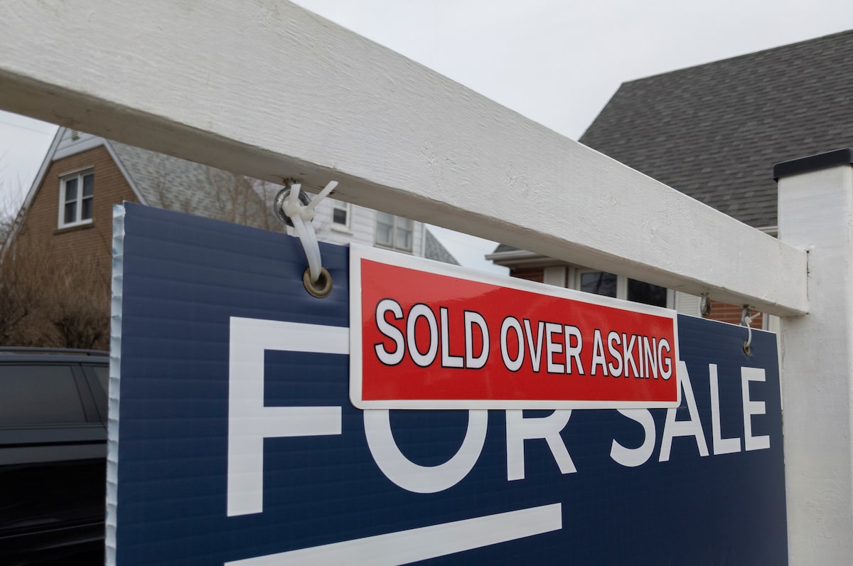 Home sold over asking sign