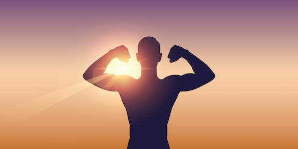 silhouette of man flexing biceps