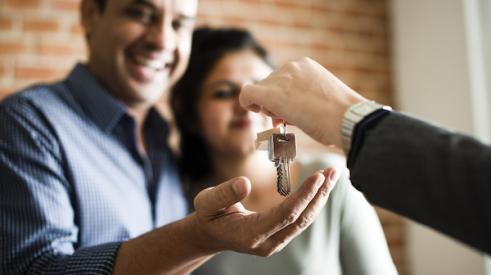 Homebuyers getting keys to new home