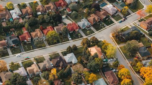 Aerial view of houses in residential community in autumn