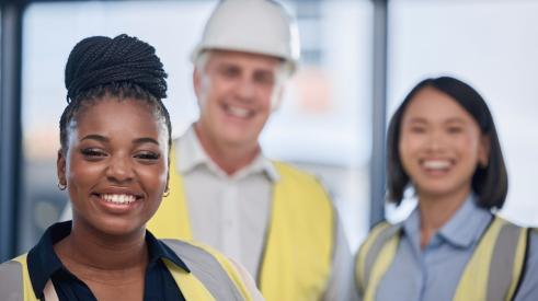 Diverse construction workforce with different ages, genders, races
