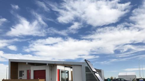 Sinatra Living from the University of Nevada, Las Vegas, team has a solar system for radiant heat and hot water linked to a Tesla Powerwall. The 965-square-foot home combines elegant design and energy smarts.