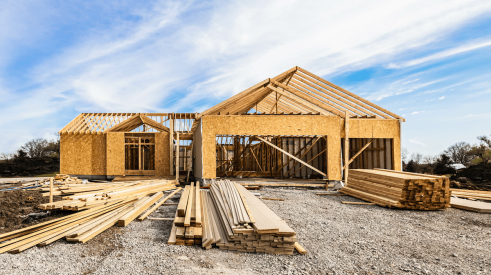 Lumber and building materials on construction site for building a new home