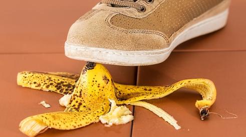 shoe stepping on banana peel and risking a fall