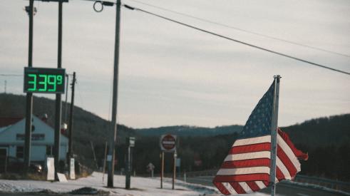 American flag against rural backdrop