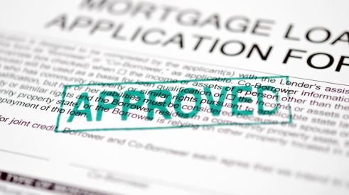 Approved stamp on mortgage loan application form