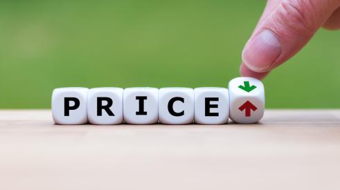Dice spelling "price" with upward arrow