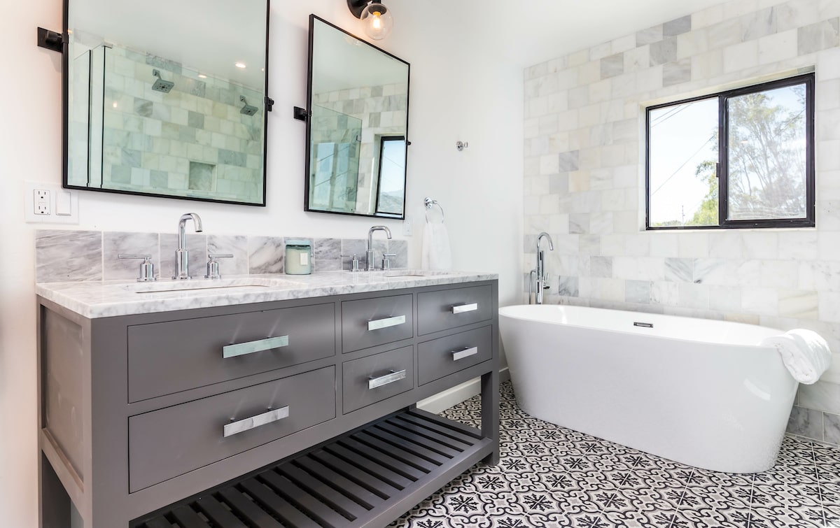 White tiled bathroom with bathtub