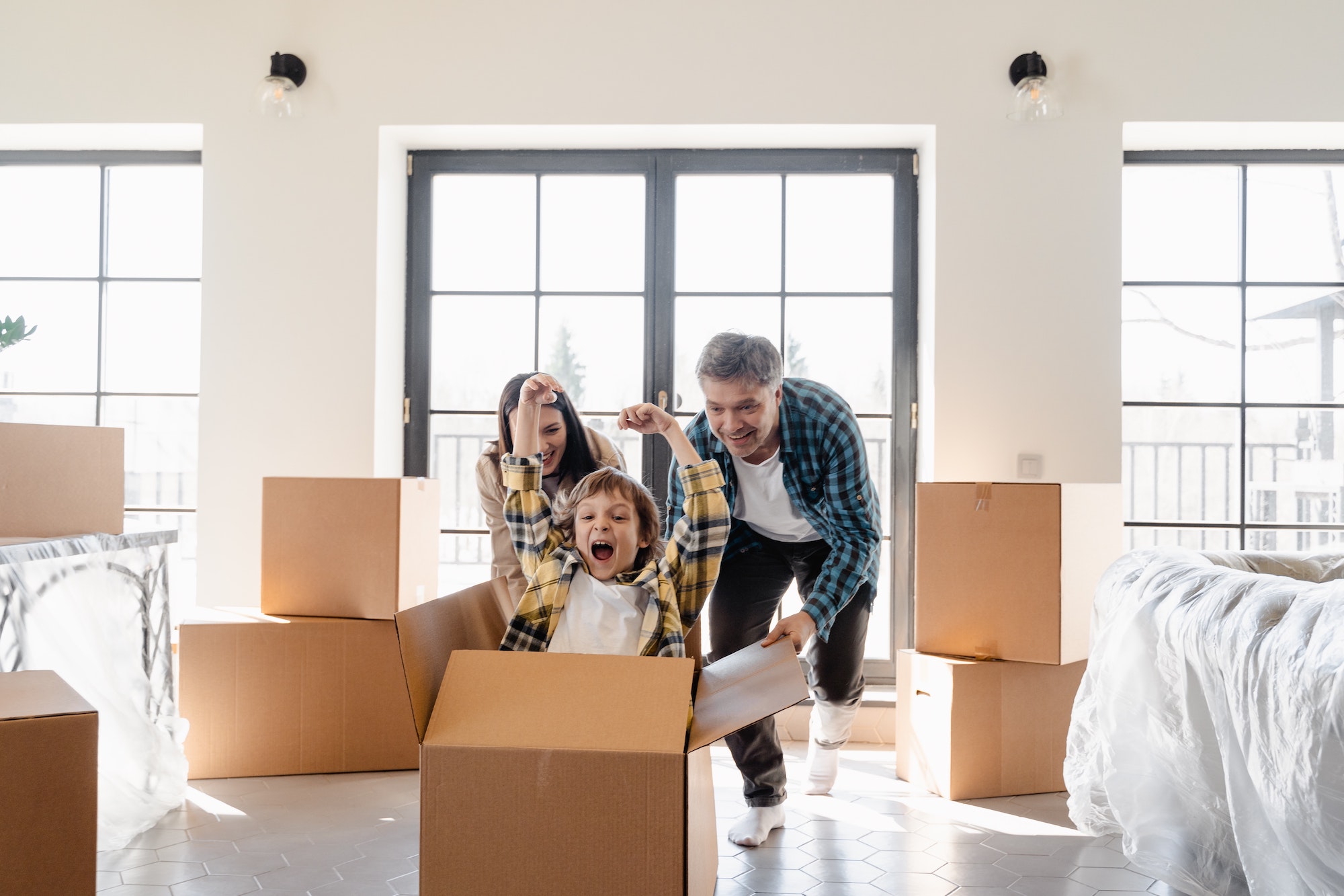 Family moving into new home. Photo by MART PRODUCTION from Pexels