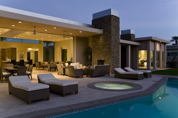 Backyard of a luxury home with pool and jacuzzi