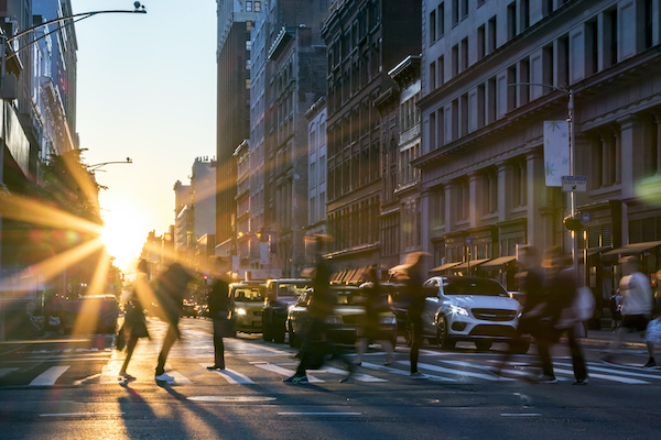 People walking across New York City street