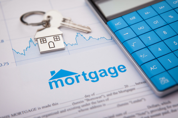 Empty mortgage application with home key and calculator 
