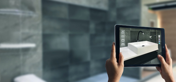 Person holding a tablet up to empty wall and seeing a virtual sink appear