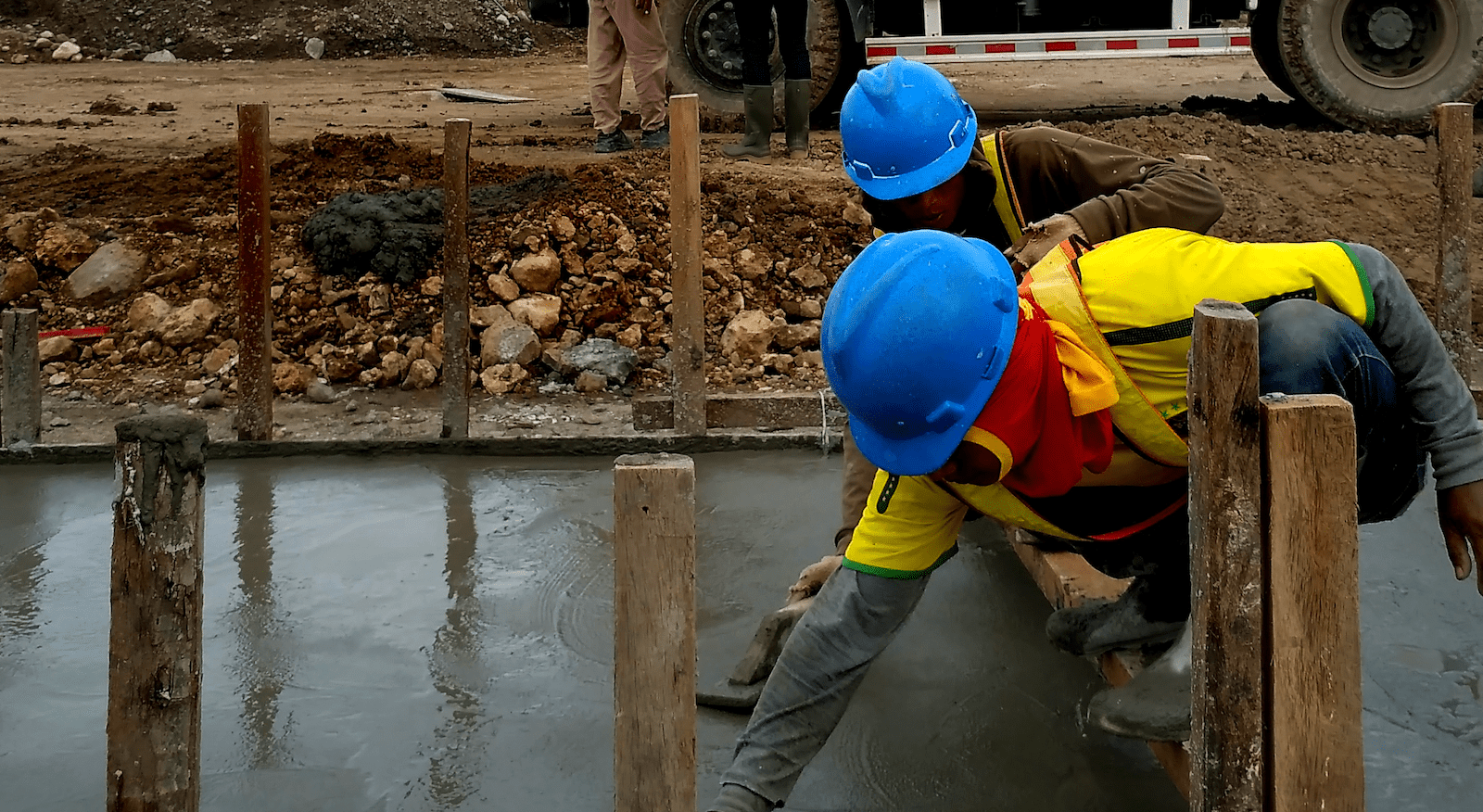 Construction workers pouring a slab