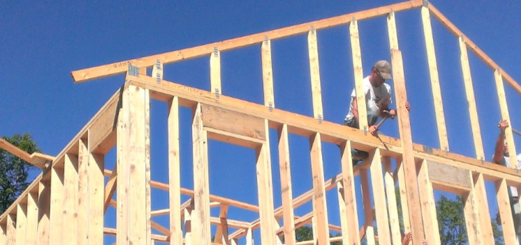 construction worker and timber house framing