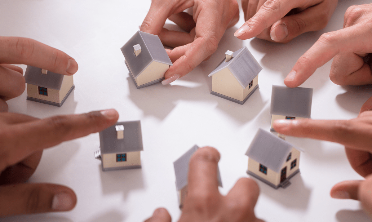 Fingers on models of homes for multiple homebuyers