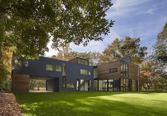 Exterior shot of modern custom home in Maryland; wood, stucco and fiber cement siding