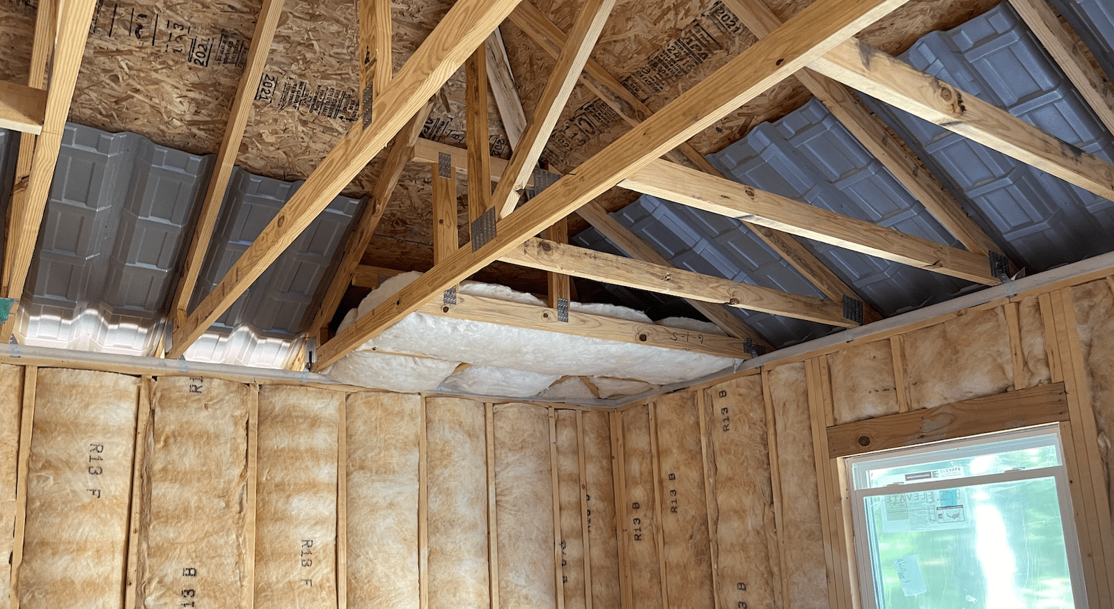 Home attic insulation batts installed in areas hard to reach 