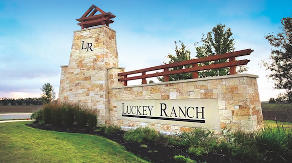 The stone gate at the entry to the Luckey Ranch new-homes development.