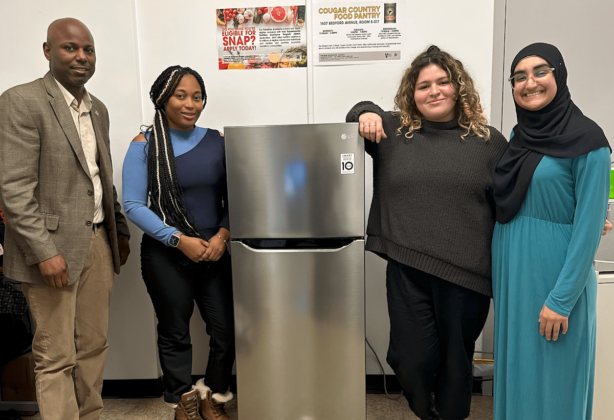Medgar Evers College students with refrigerator
