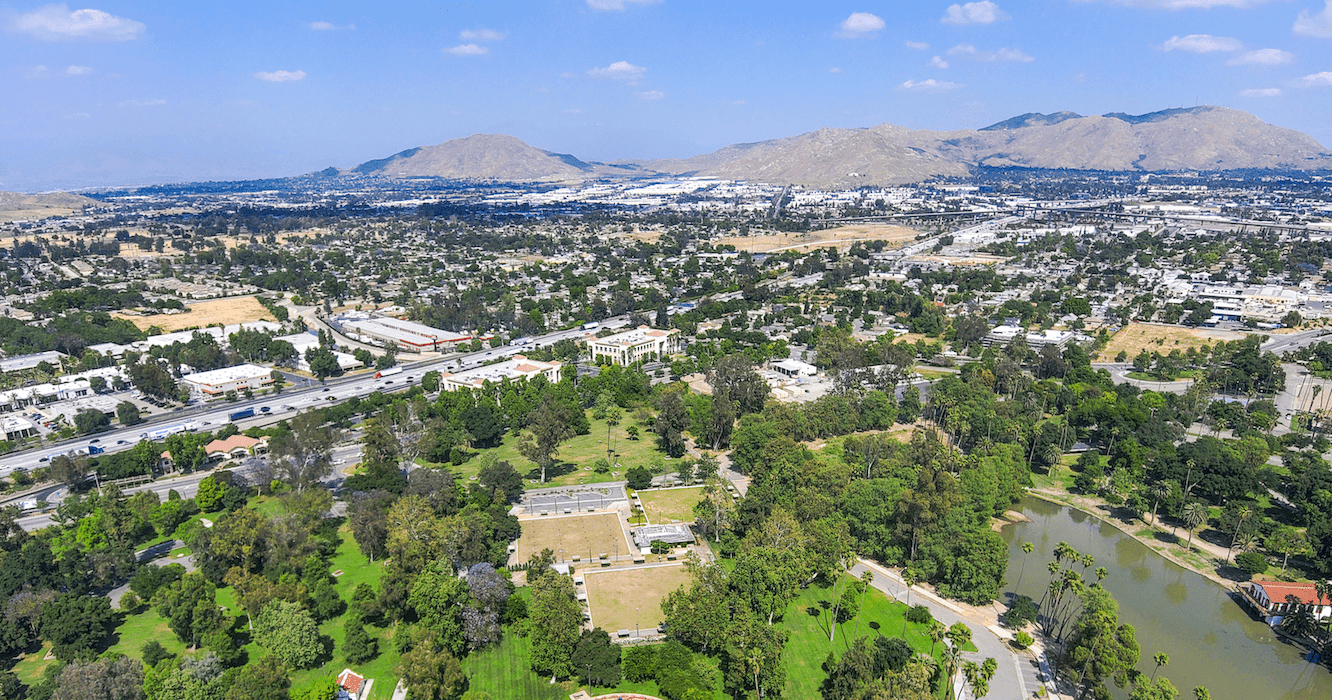 Aerial view of Riverside, California, with mountains in the distance 