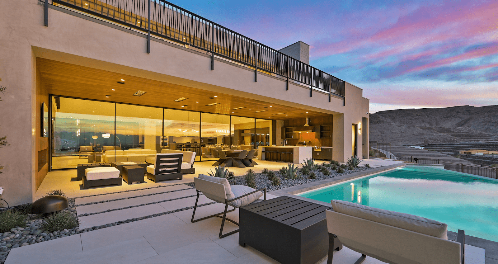 Outdoor living space by the pool at The New American Home 2023