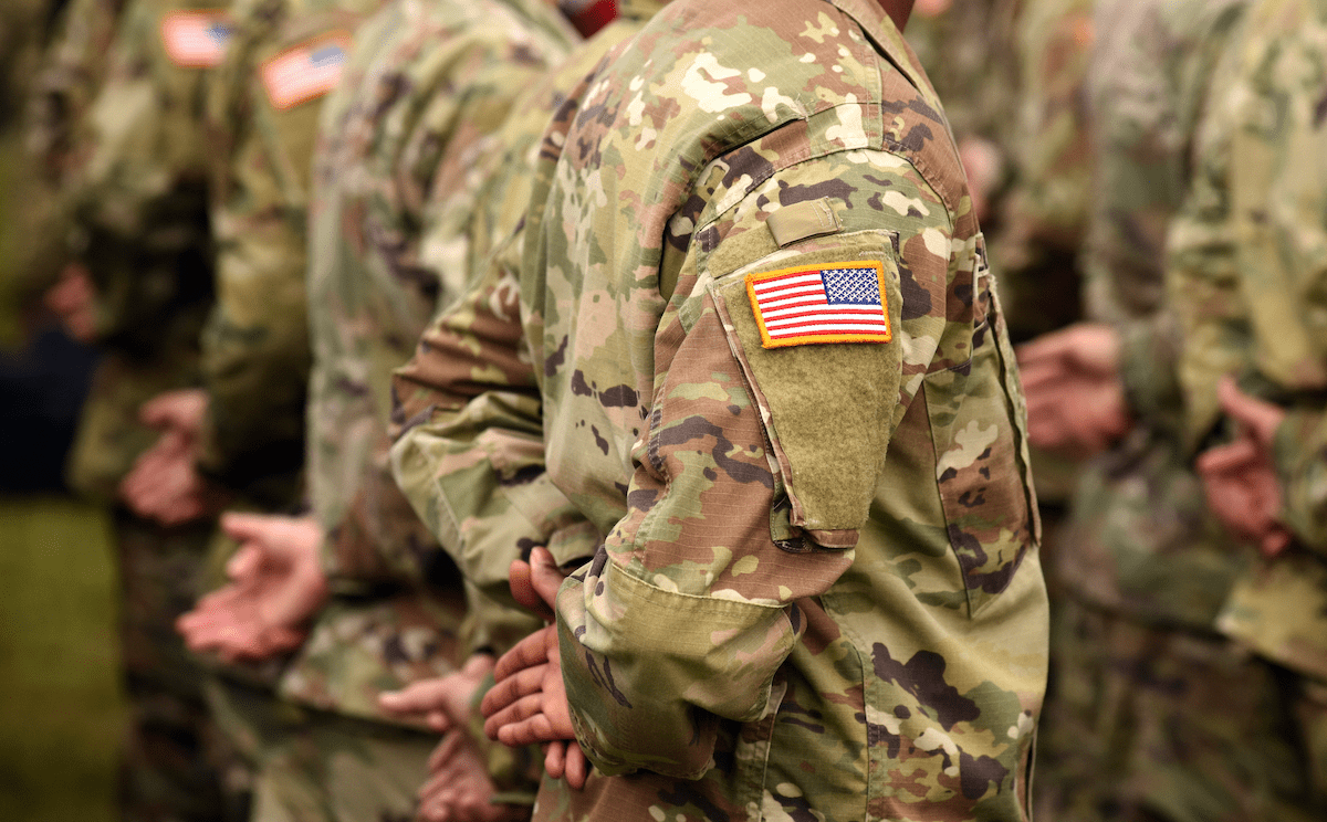 Members of U.S. army standing at ease