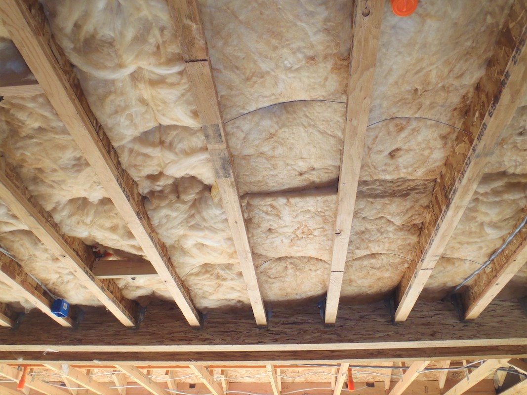 Insulation for an above-garage floor area 