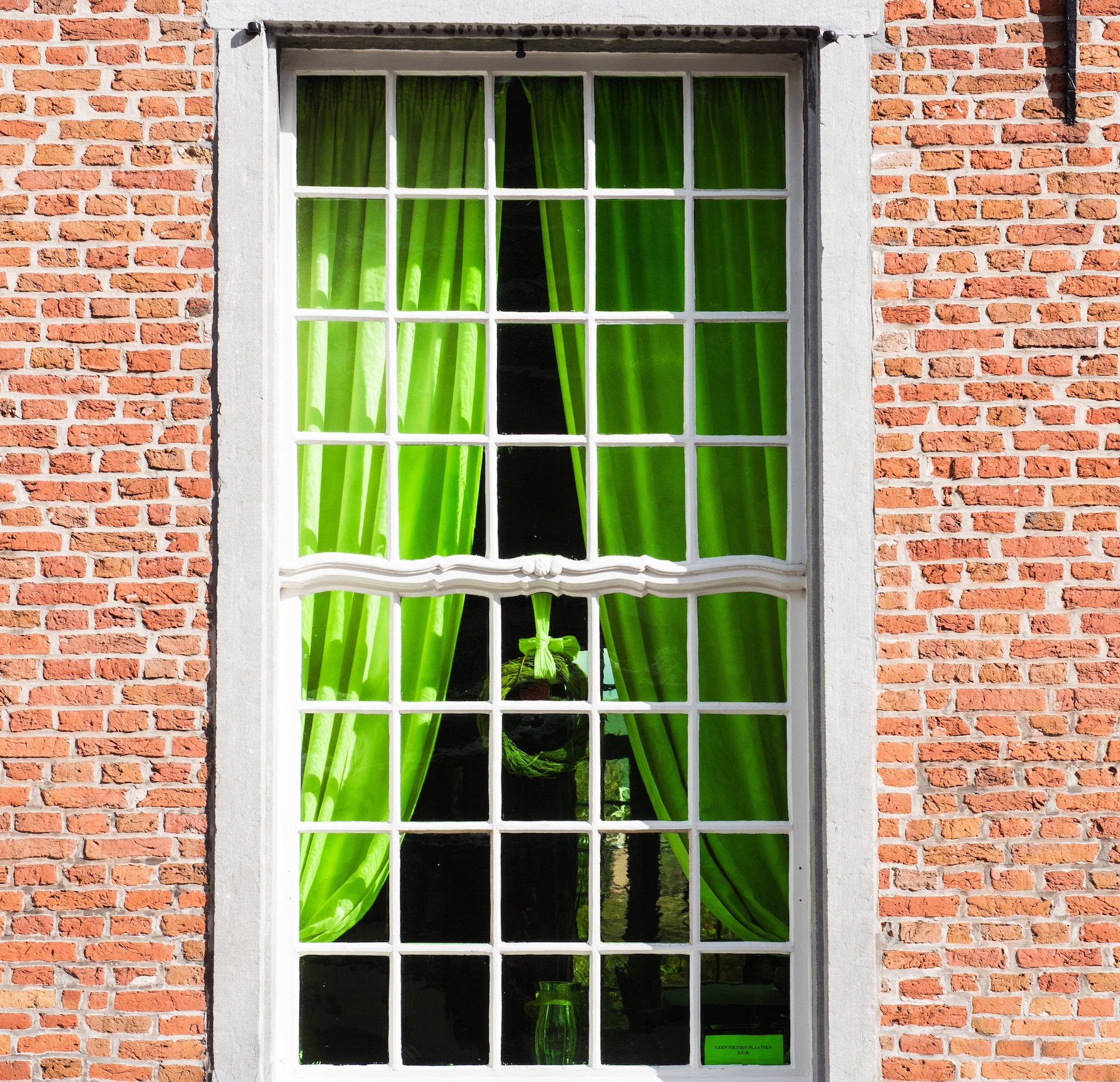 Window with green curtains
