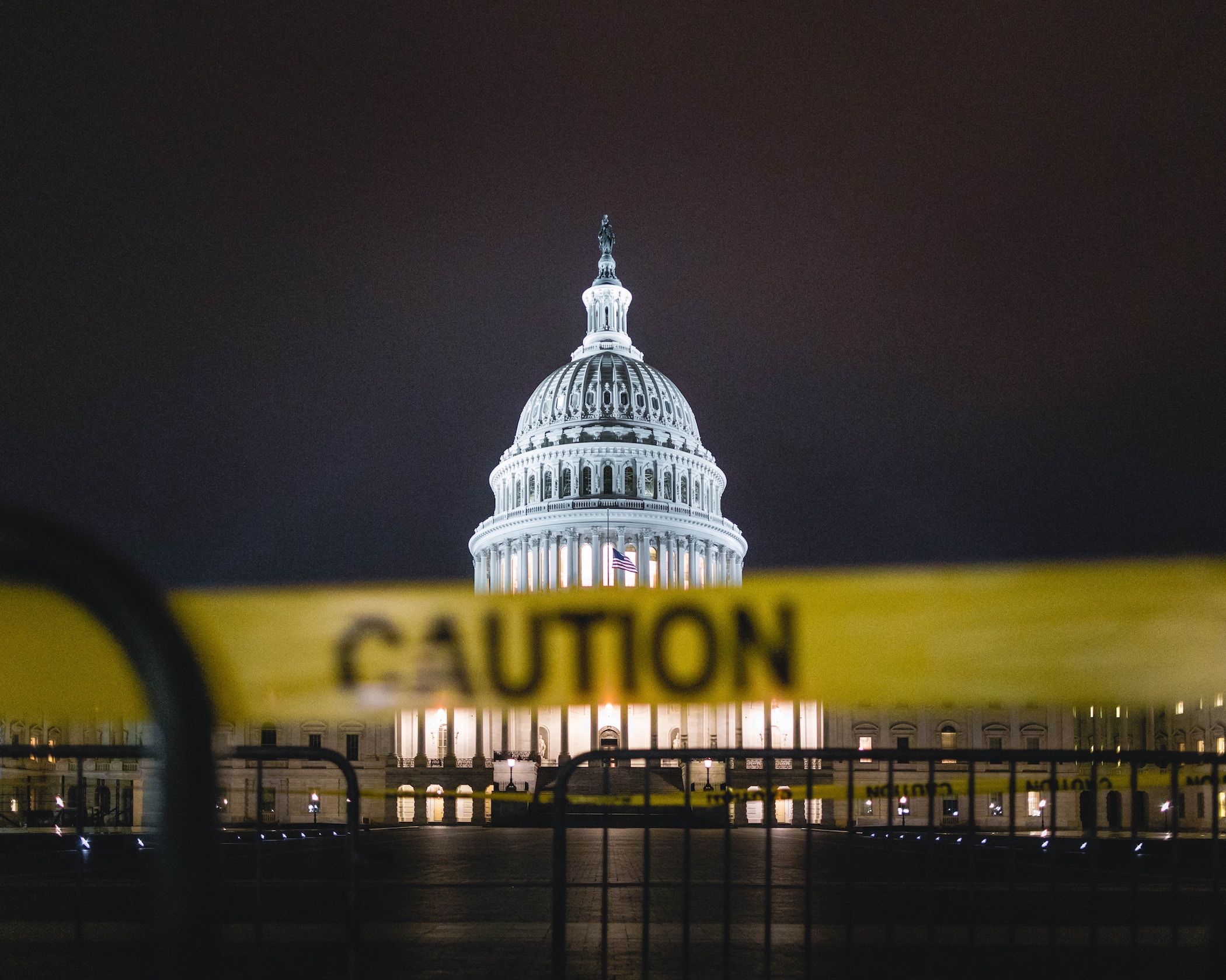 U.S. Capitol with yellow caution tape in front of it