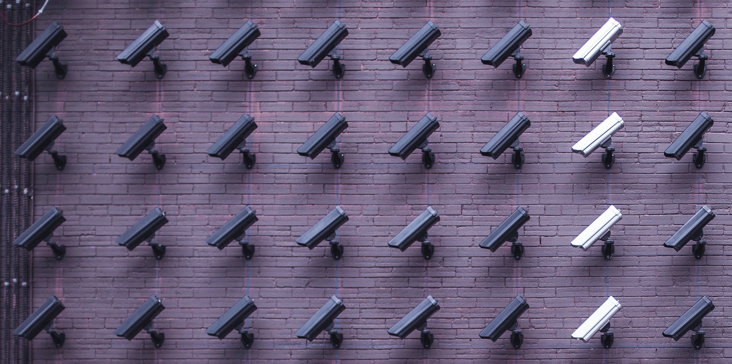 Security Cameras on a brick wall