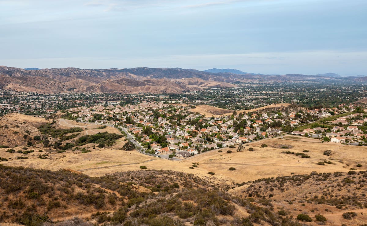 Housing neighborhood in dry landscape from California drought