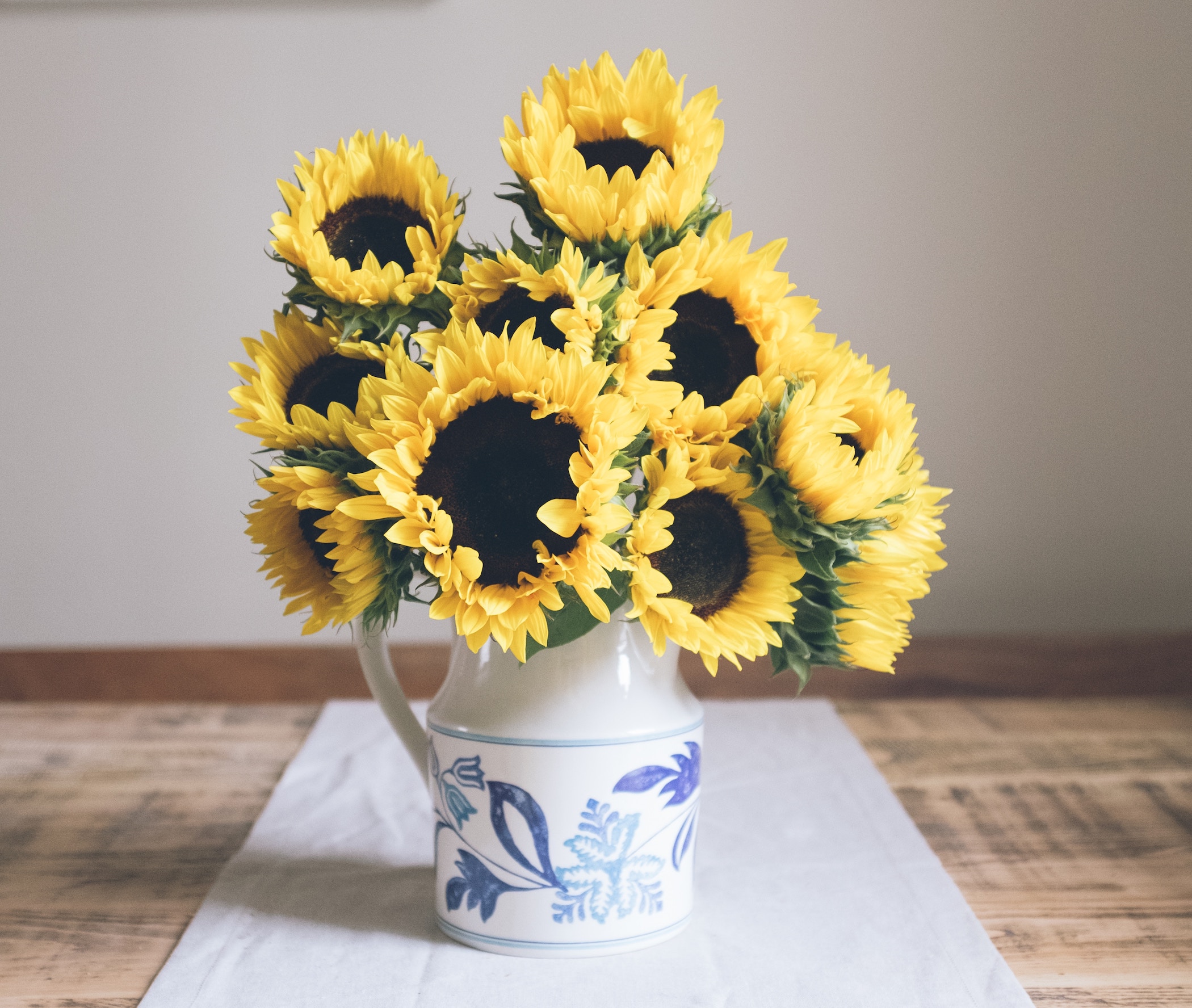 Sunflowers on a dining table in a home