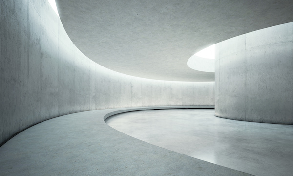 Concrete hallway with curved wall