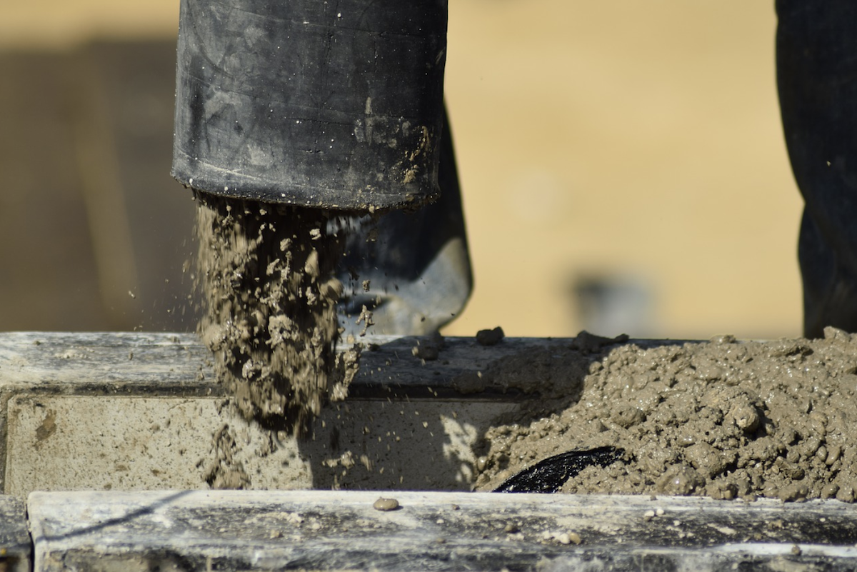 Concrete pump pouring concrete for home foundation